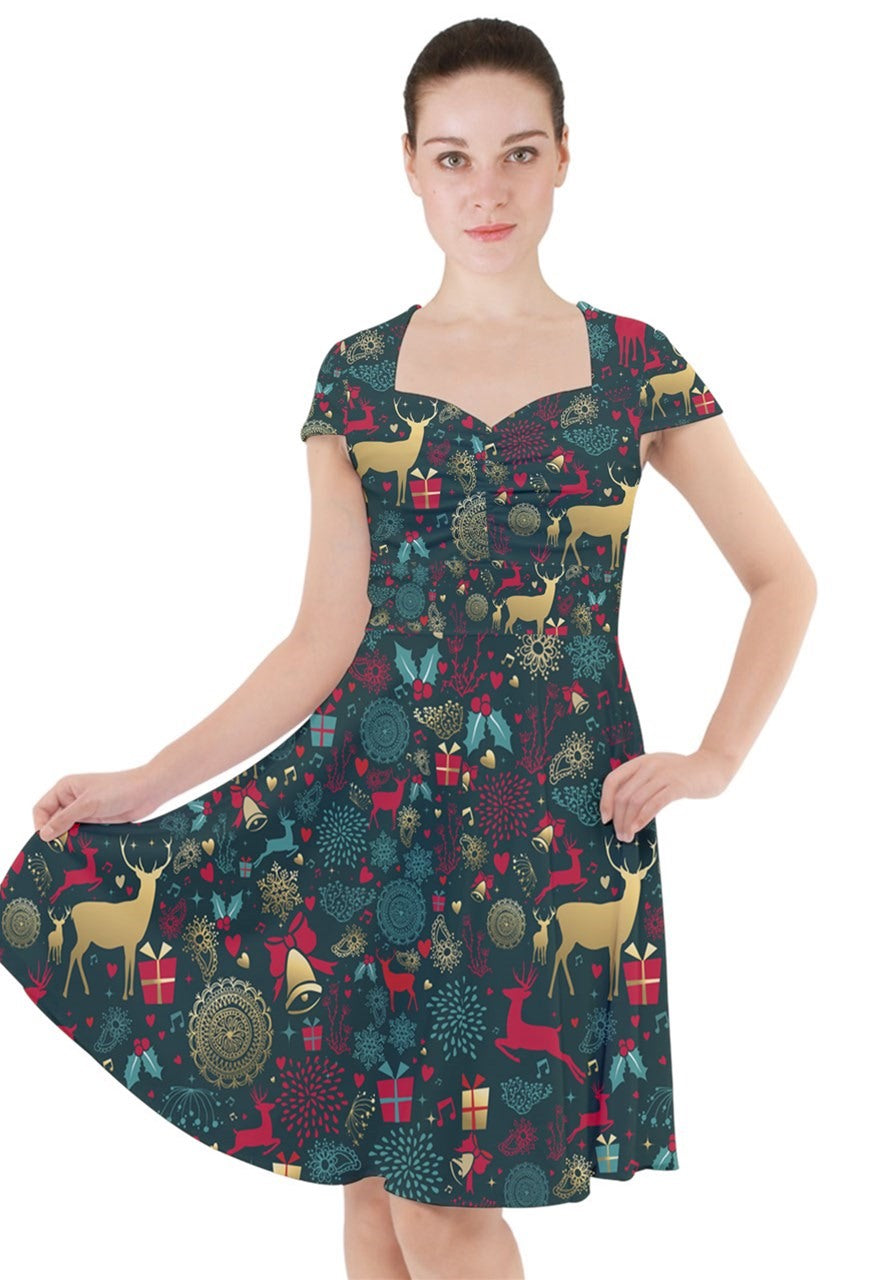 Model showcasing a Christmas reindeer cap sleeve midi dress featuring festive patterns and pockets.