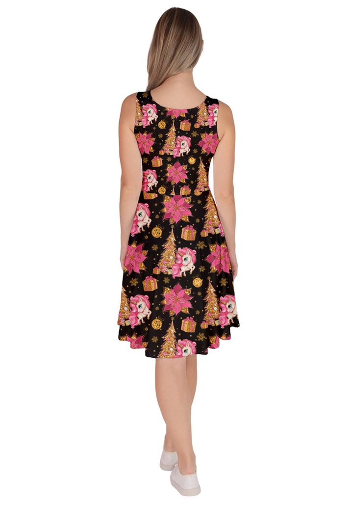 Back view of a black knee-length skater dress with festive unicorn and Christmas floral prints.