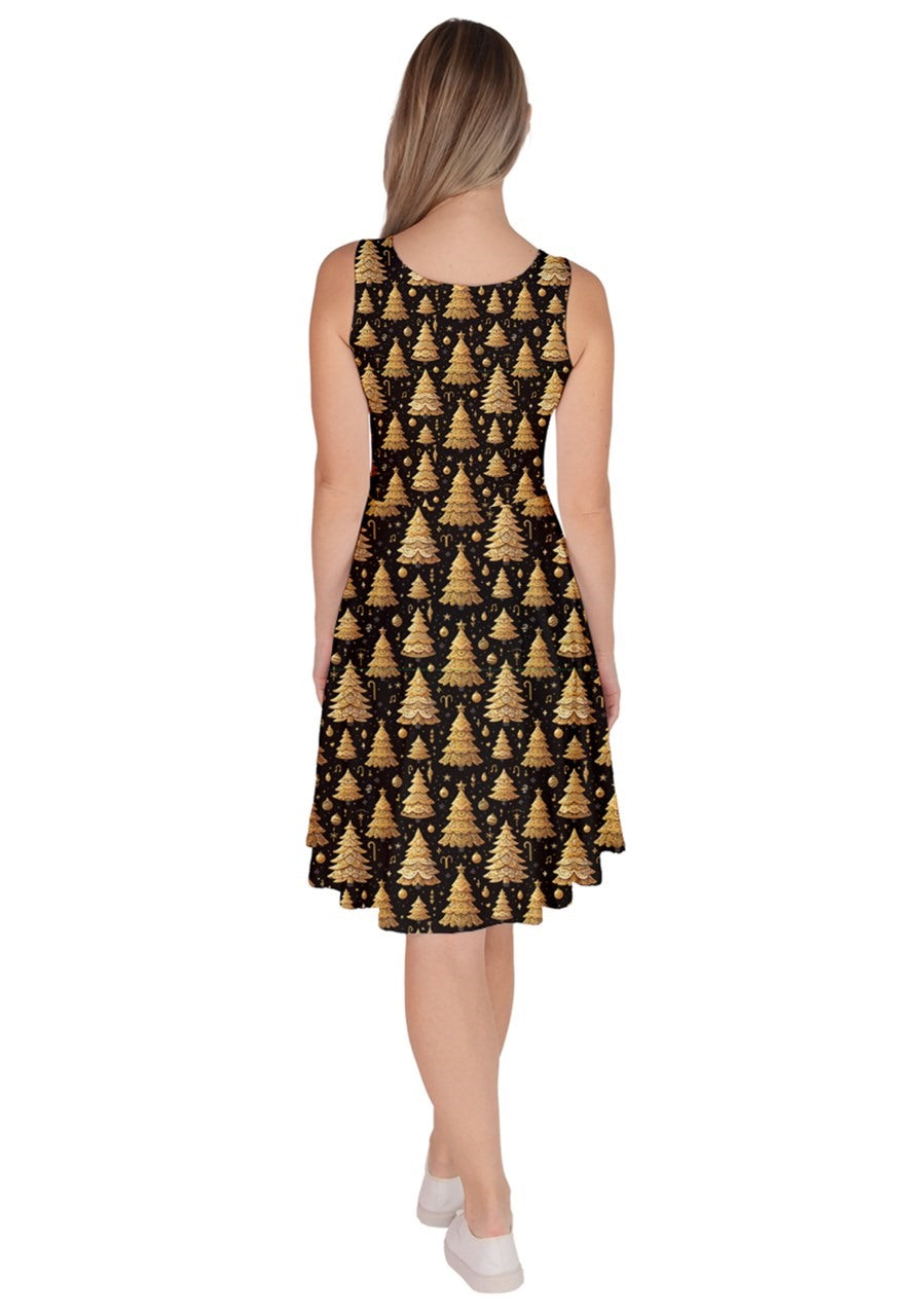 Back view of O Christmas Tree knee length skater dress with gold Christmas tree print on a black background.