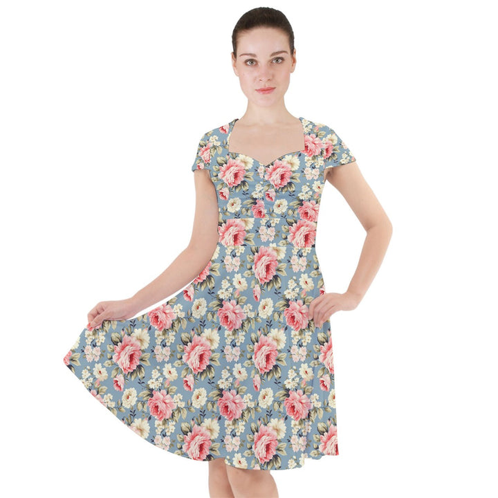 Vintage rose cap sleeve midi dress features a floral design on a greyish-blue background, perfect for elegant occasions.