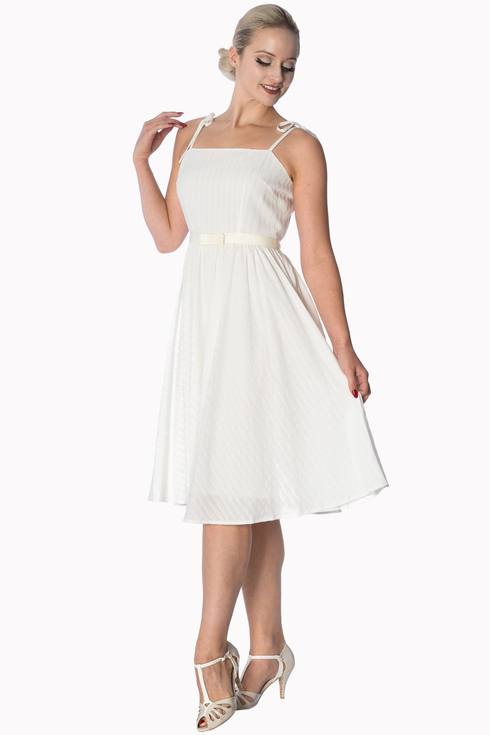 Elegant white strappy sundress with embroidered stripes and a bow-tie belt, perfect for any occasion.