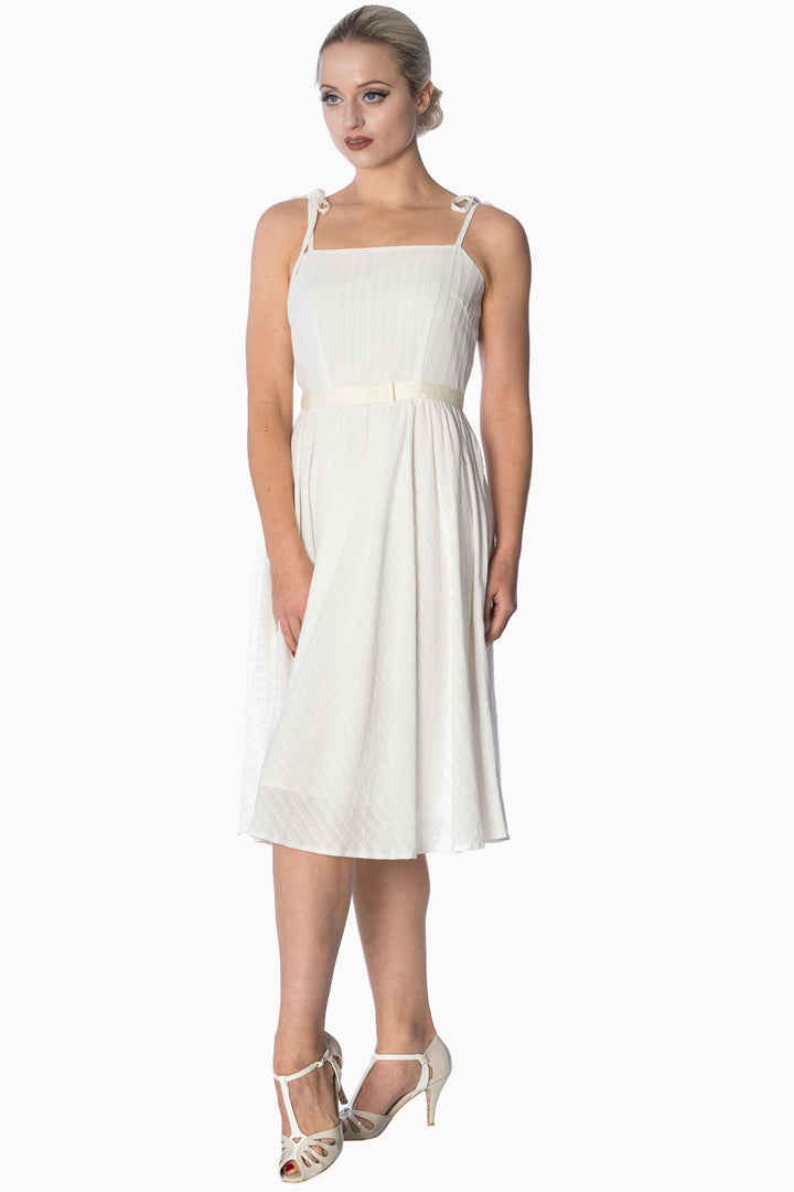 Elegant white strappy sundress with embroidered stripes, perfect for any occasion.