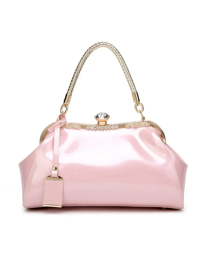 Pink patent women's handbag with rhinestone lock and stylish chain handle, perfect for a chic accessory collection.