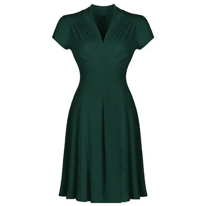 Timeless Elegance Vintage Dress in dark green, featuring chic cap sleeves and a flattering silhouette, perfect for retro fashion enthusiasts.