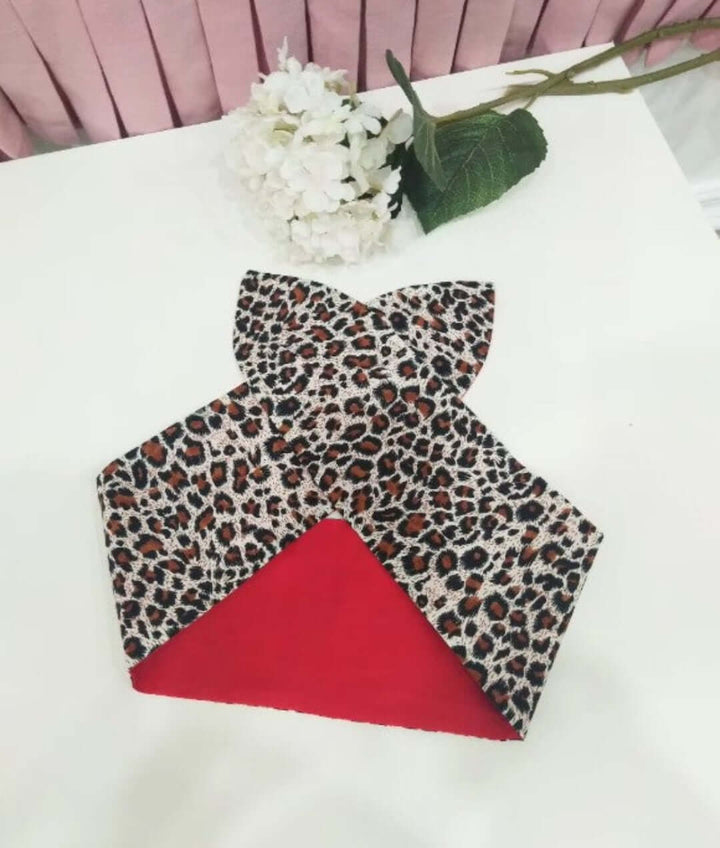 La Cheetah leopard print wired rockabilly hair tie with red backing, perfect for stylish hairdos and bold fashion statements.