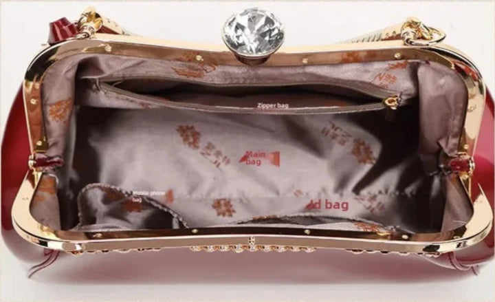 interior view of burgundy patent women's handbag showcasing elegant lining and compartments for organization