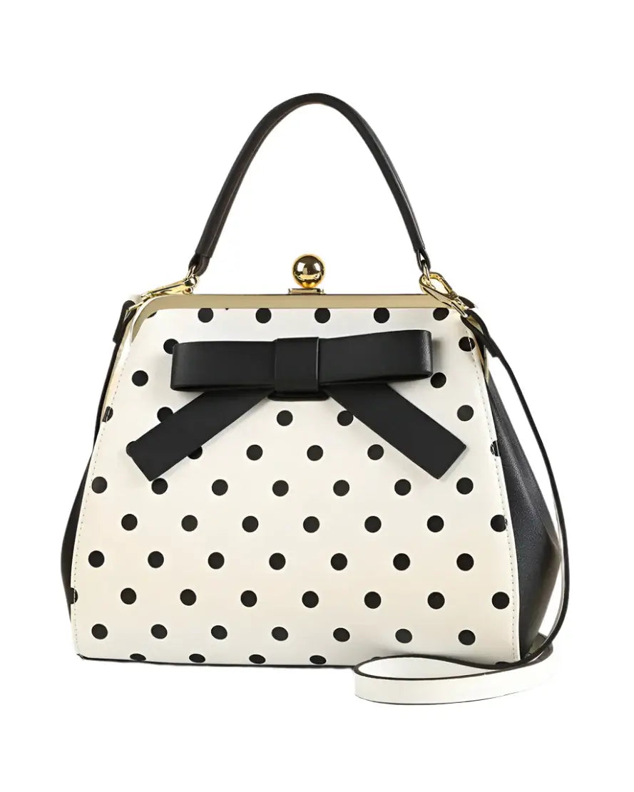 Black and white polka dot rockabilly handbag with bow detail, perfect for vintage and retro outfits.