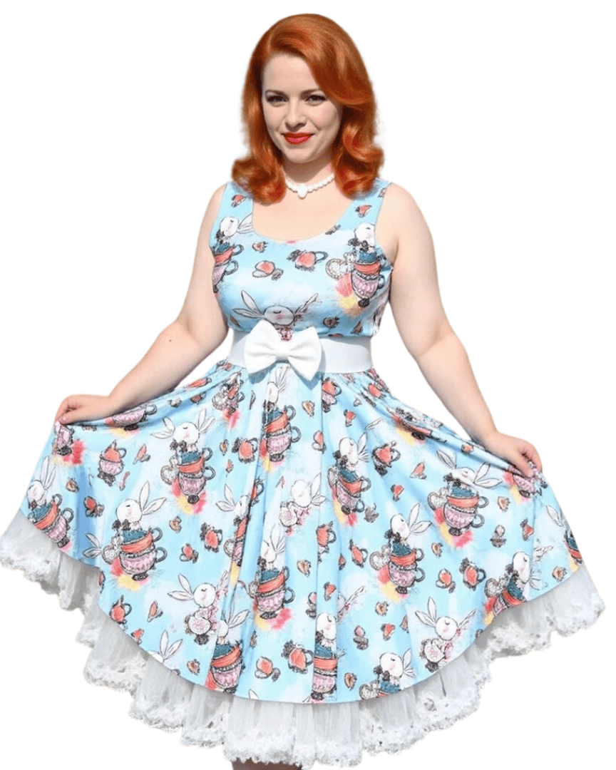 Model wearing a whimsical blue skater dress with bunny and floral patterns, perfect for Alice in Wonderland-themed events.