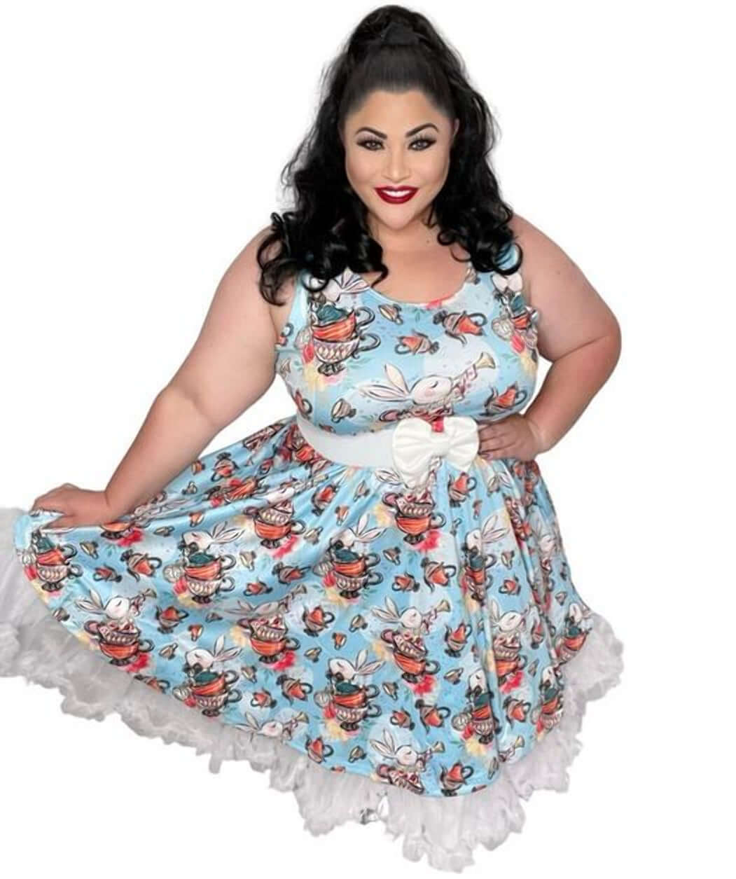 Plus-size model wearing a whimsical skater dress with a tea party print, perfect for Alice in Wonderland-themed events.