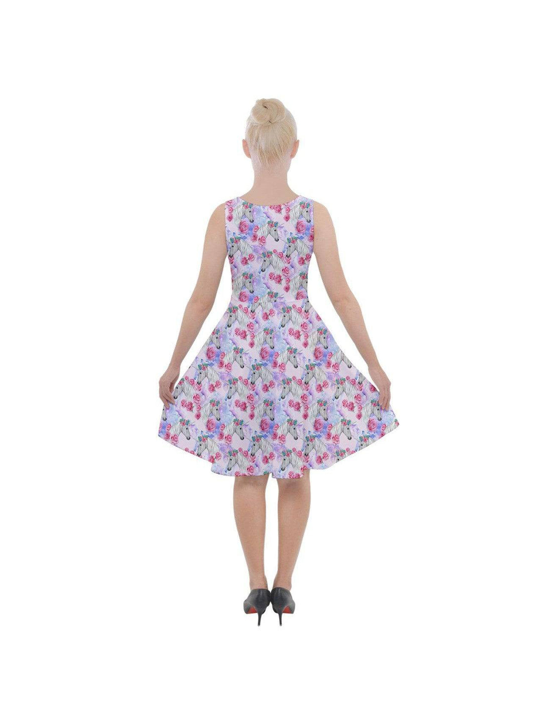 Back view of a ladies' knee-length skater dress with colorful unicorn and floral prints, featuring a flared skirt design.