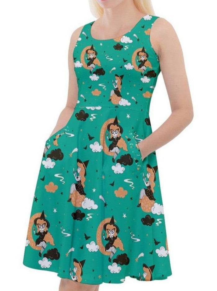 PIN UP WITCH GREEN knee length skater dress with pockets, featuring a playful witch pattern on soft stretch fabric.