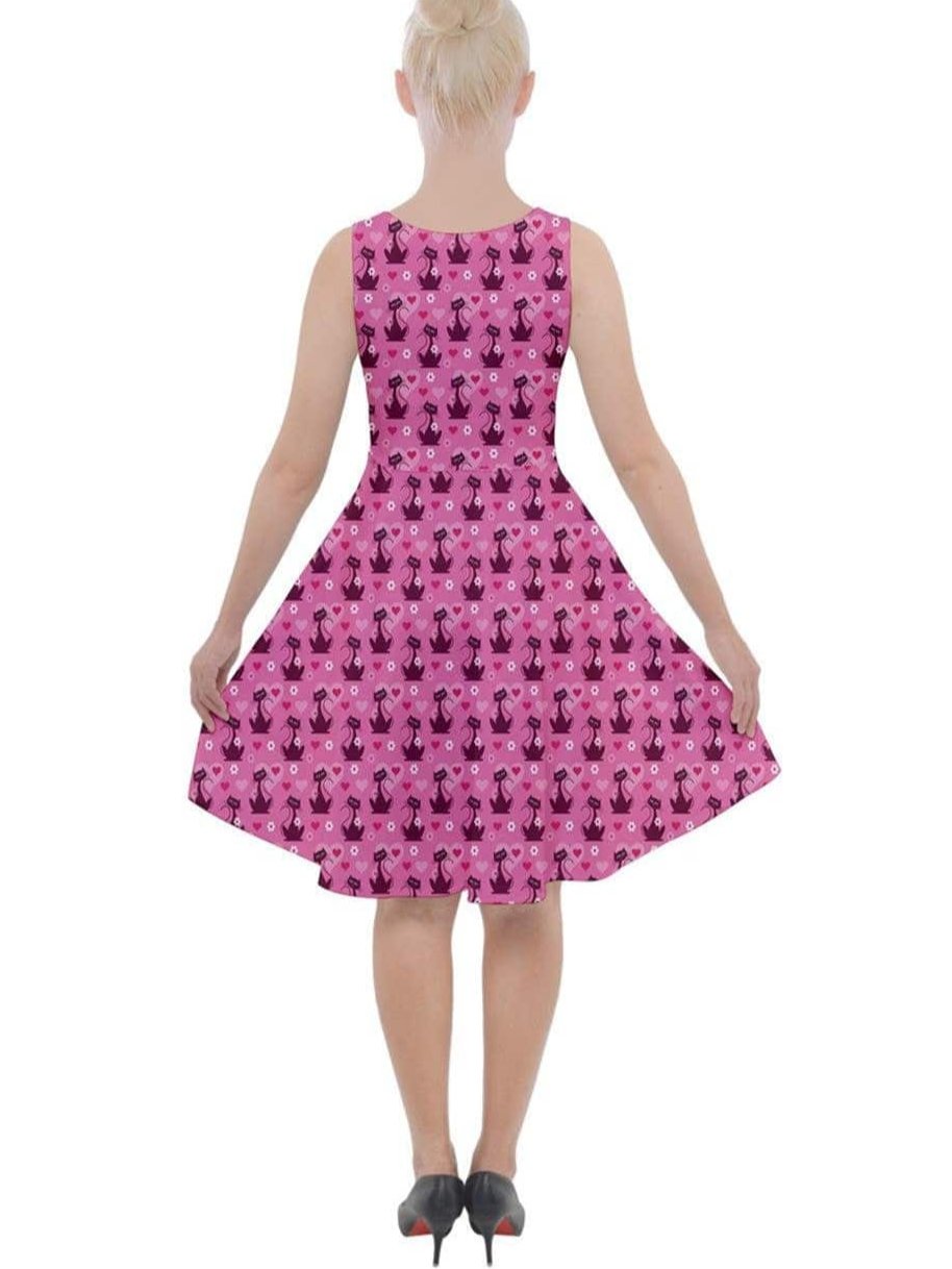 Back view of a pink Retro Love Cats knee-length skater dress featuring a playful cat pattern and a flattering flared silhouette.