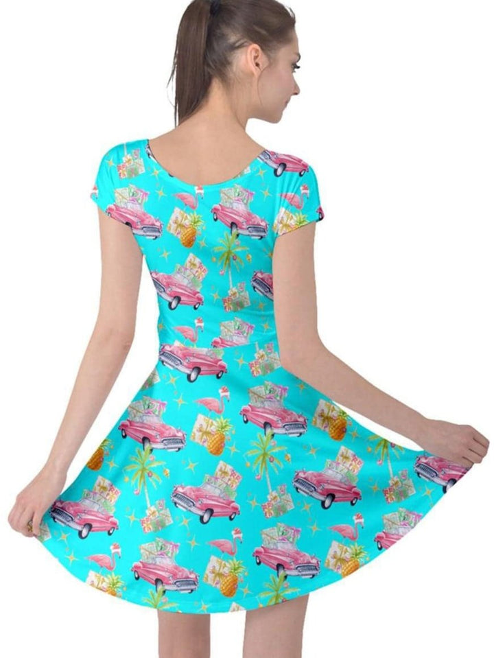 Tropical Christmas cap sleeve dress with flamingos and classic cars, perfect for festive celebrations.