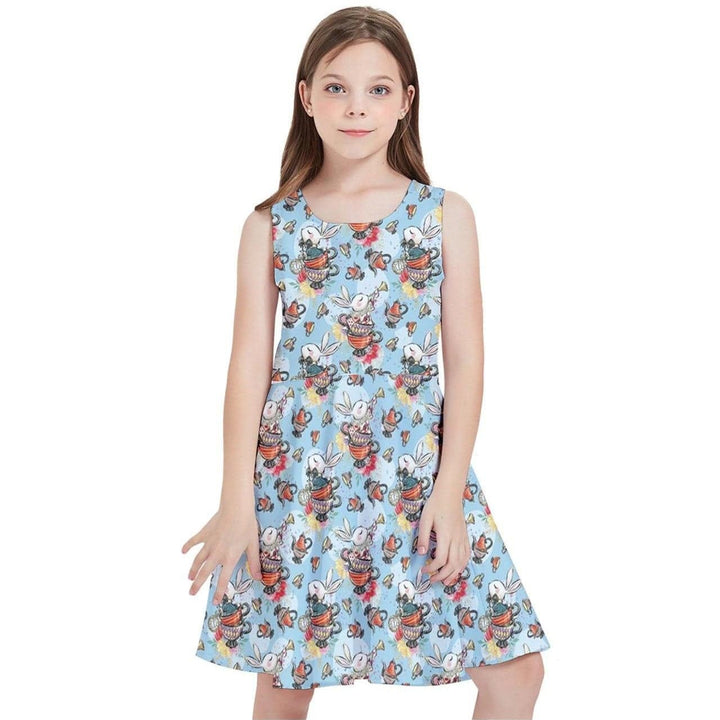 Little girl wearing a blue skater dress with a whimsical White Rabbit print, inspired by Alice in Wonderland.