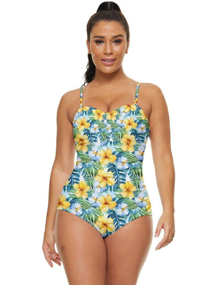 Model showcasing a Tropical Hibiscus Full Coverage Swimsuit with vibrant floral print, perfect for beach days.