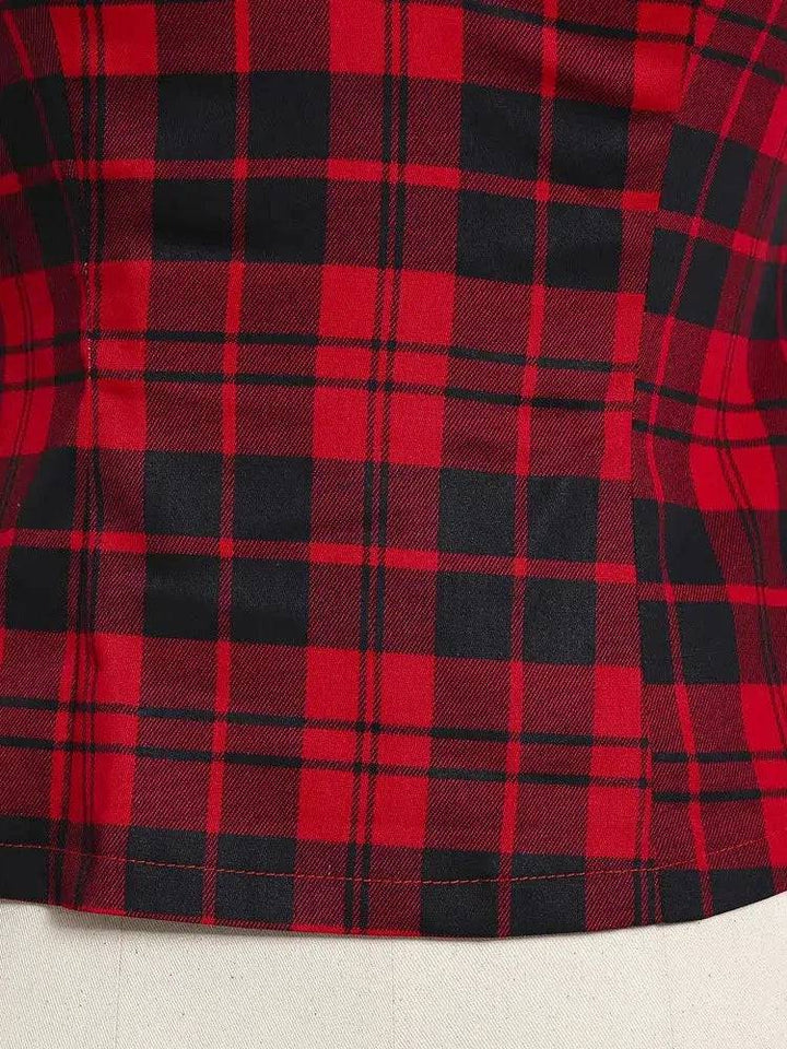 Close-up view of the red plaid pattern on a retro top, showcasing its bold design and vintage charm.